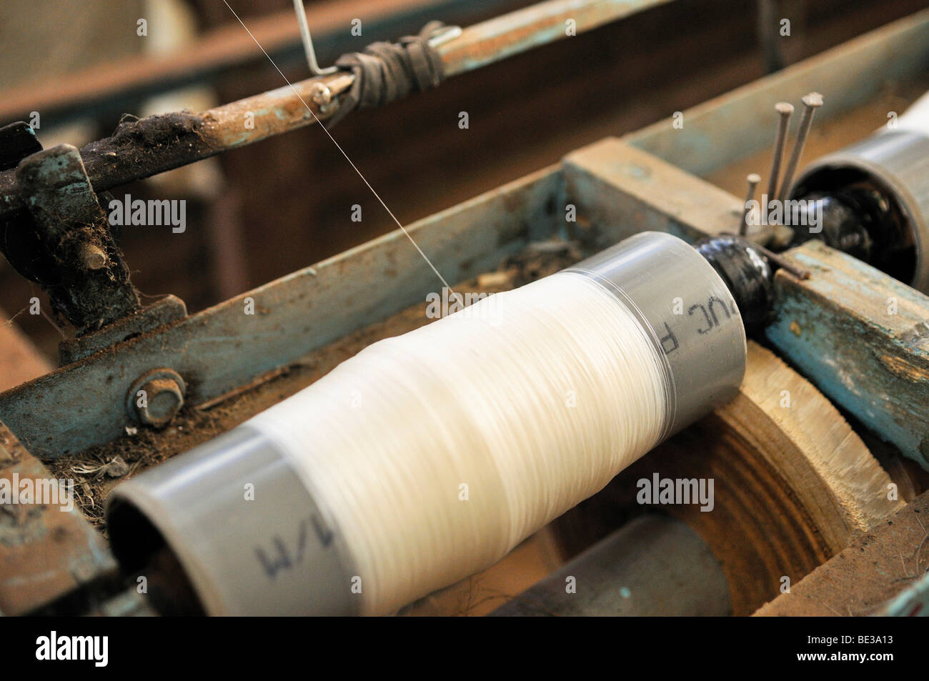 Spool of silk on the loom in a silk factory, Dalat capital, Central Highlands, Vietnam, Asia Stock Photo