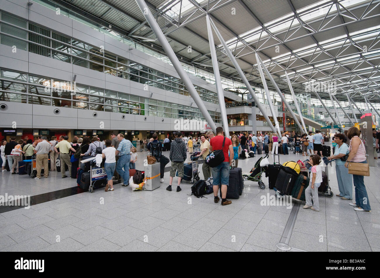 Duesseldorf International Airport, queue in front of check-in desk, travel season, North Rhine-Westphalia, Germany, Europe Stock Photo