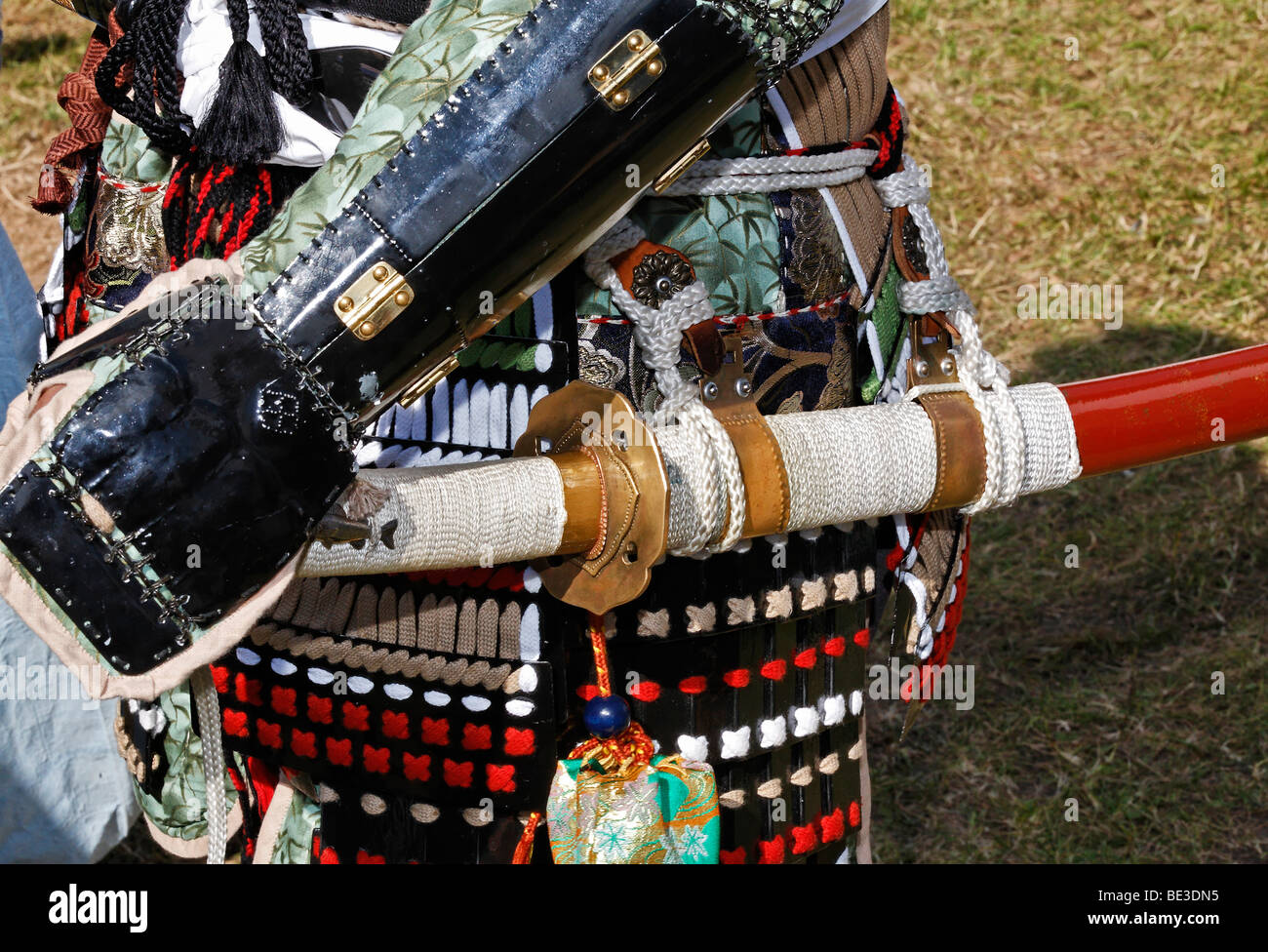 Man in a historical Japanese officer's armour with sword, reproduction after patterns from the 16th Century, Samurai Takeda Gro Stock Photo