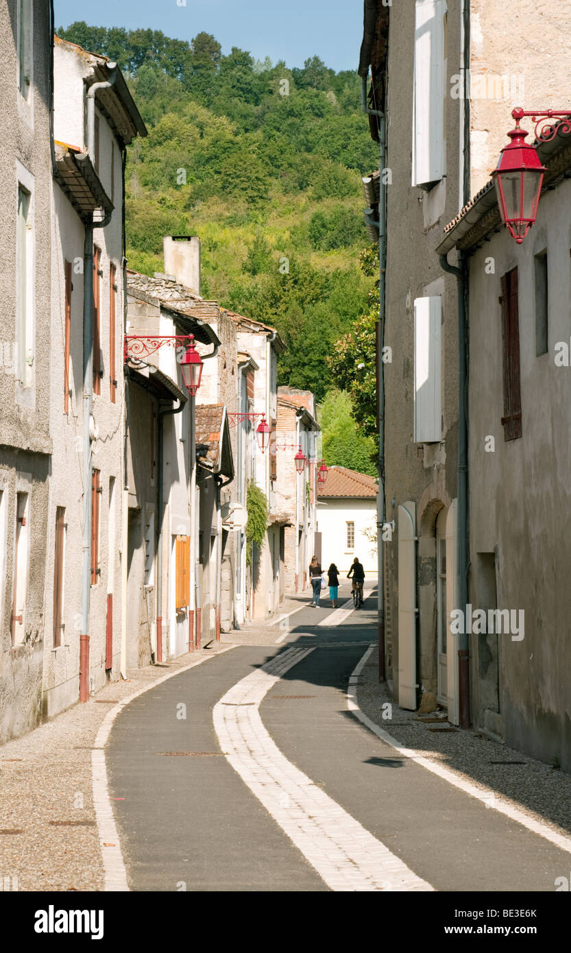 People walking in a quiet side street, Castelmoron sur Lot, Aquitaine, France Stock Photo