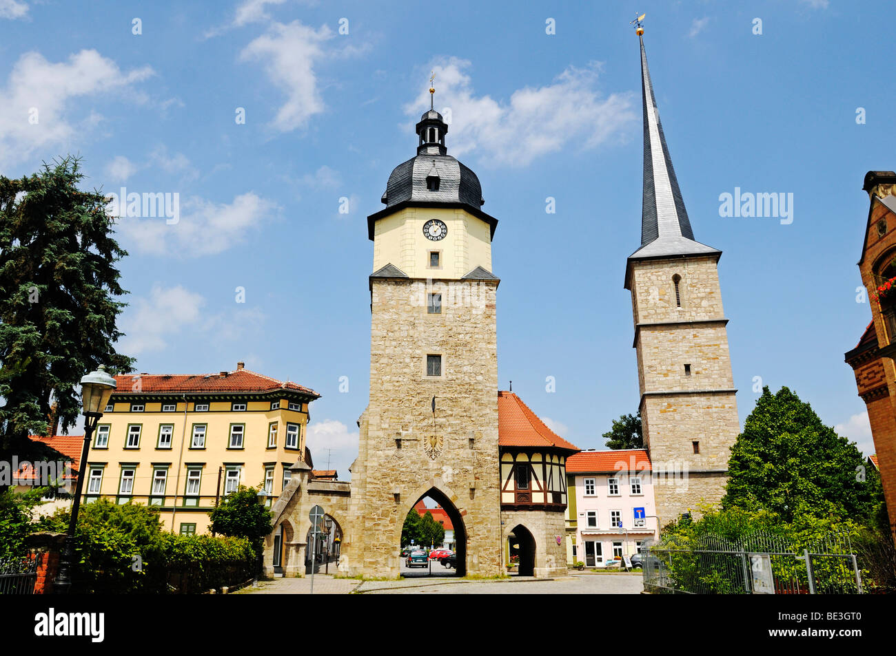 Historic city gate next to Riedturm Tower and the tower of St Jakobus pilgrimage church, Riedplatz Square, Arnstadt, Thuringia, Stock Photo