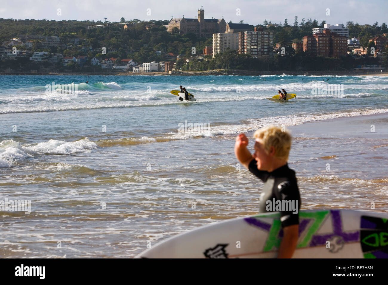 Surfers at Manly Beach. Sydney, New South Wales, AUSTRALIA Stock Photo