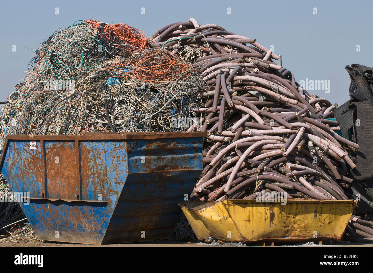 Metal recycling, containers filled with cable waste Stock Photo