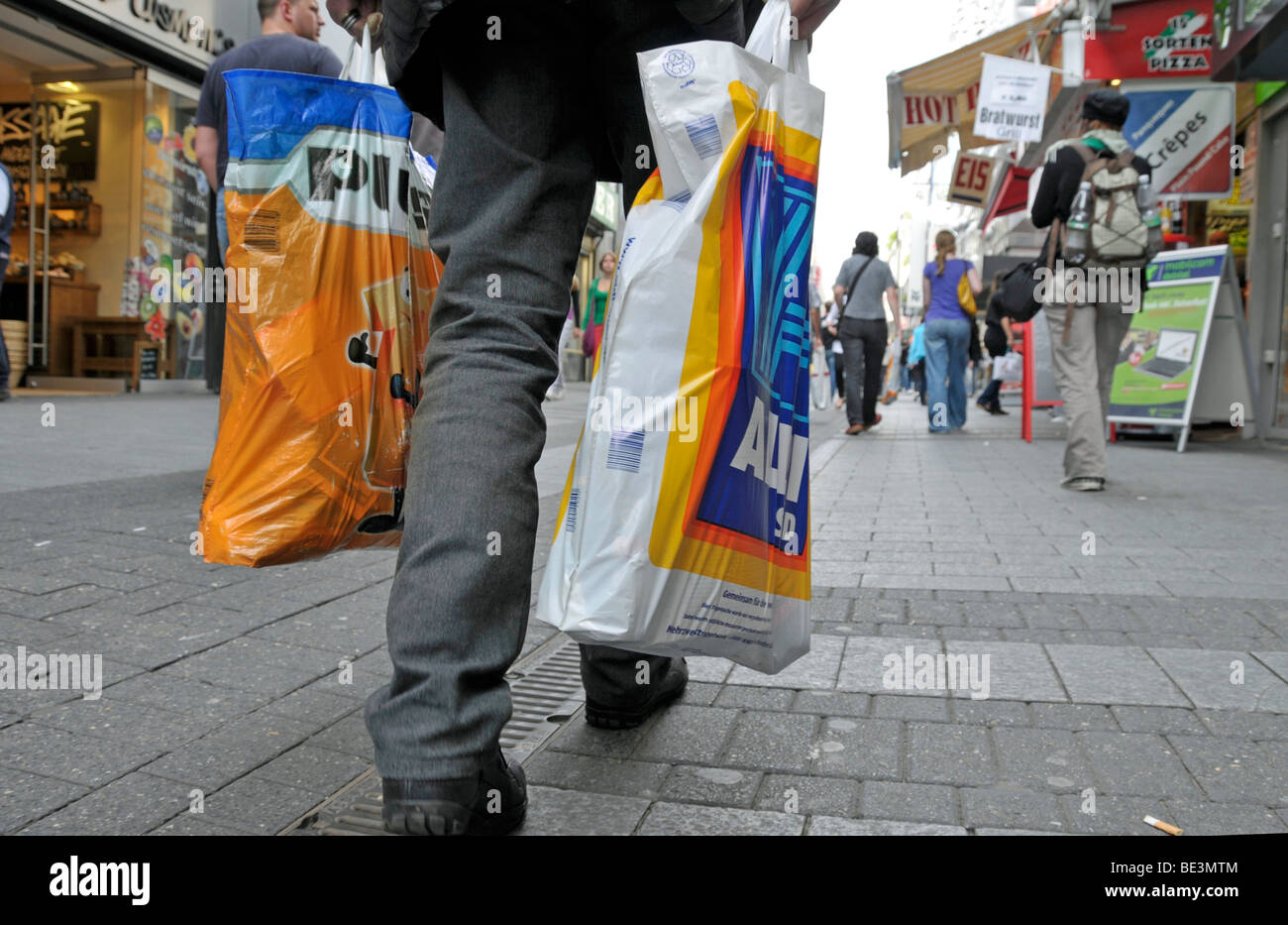 Old man after shopping at the discounters Aldi Sued and Plus, pedestrian  area in Cologne, North Rhine-Westphalia, Germany, Euro Stock Photo - Alamy