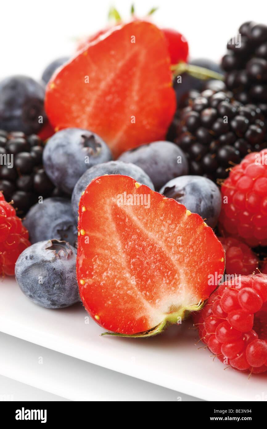 Wild berries, raspberries, blackberries, blueberries, currants, strawberries Stock Photo