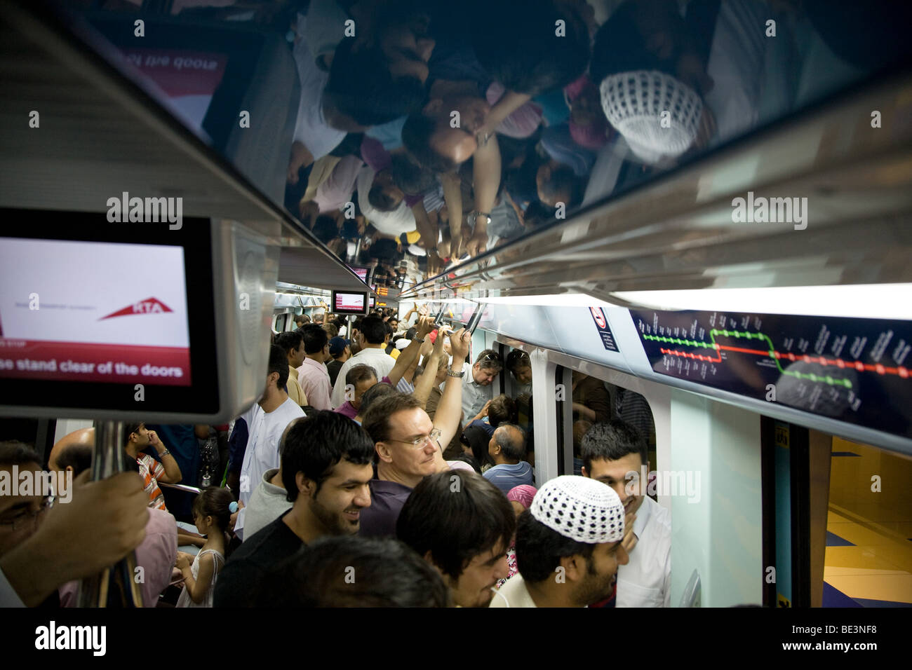 rush hour commuters dubai metro train overcrowding Stock Photo