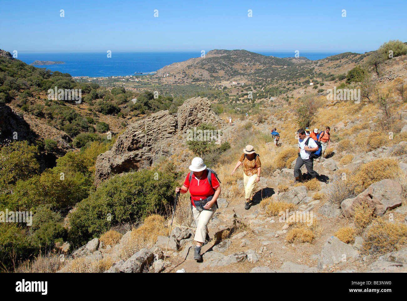 Group hiking in a Mediterranean landscape, Maquis, Mill Valley at Petra, Lesbos, Aegean Sea, Greece, Europe Stock Photo