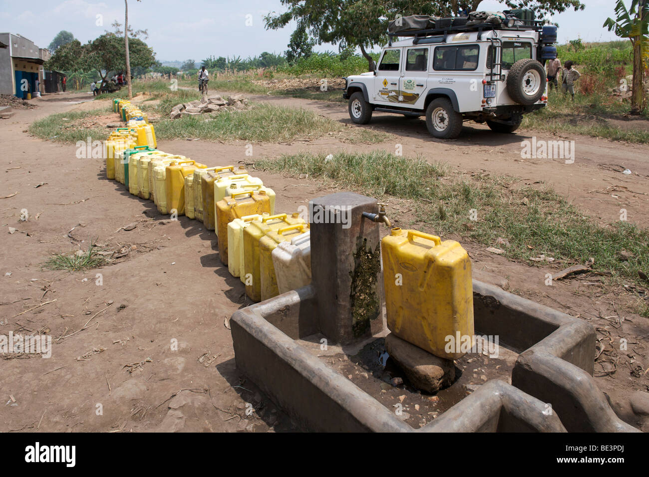 Plastic containers waiting to be filled at a tap in western Uganda