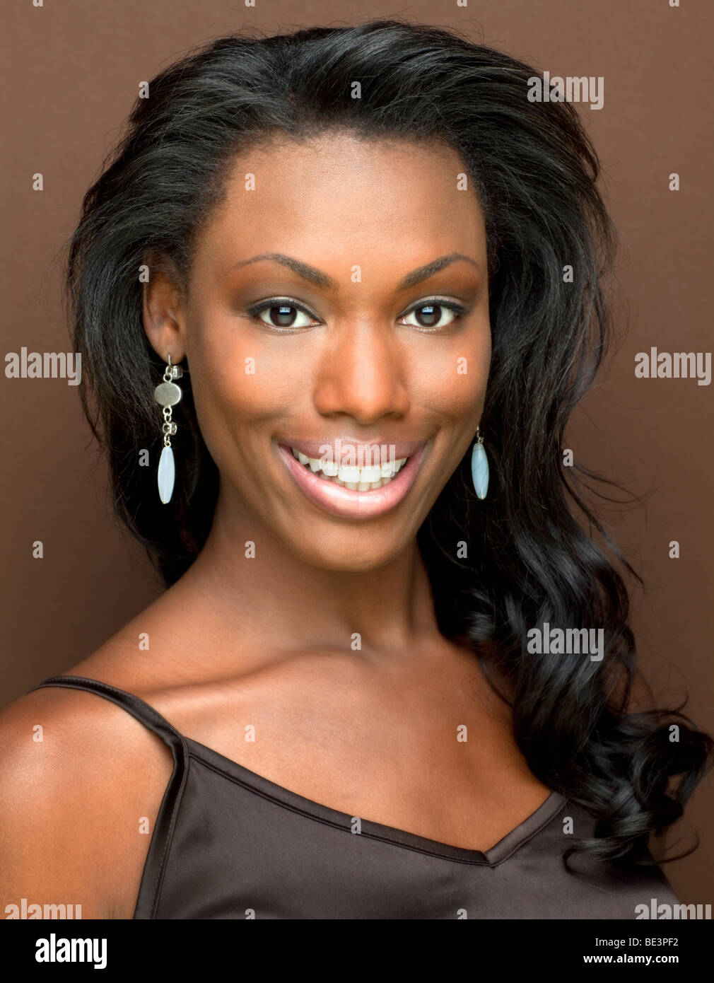 Portrait of a beautiful black woman in studio smiling Stock Photo Alamy