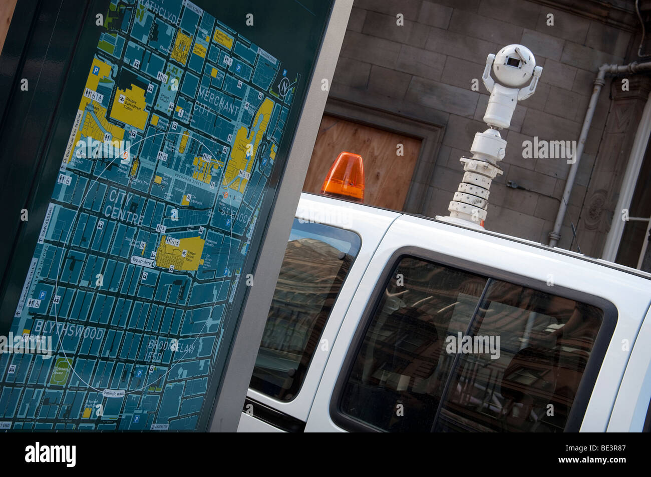 A mobile CCTV van parked next to a map of Glasgow City Center outside Glasgow Central Station