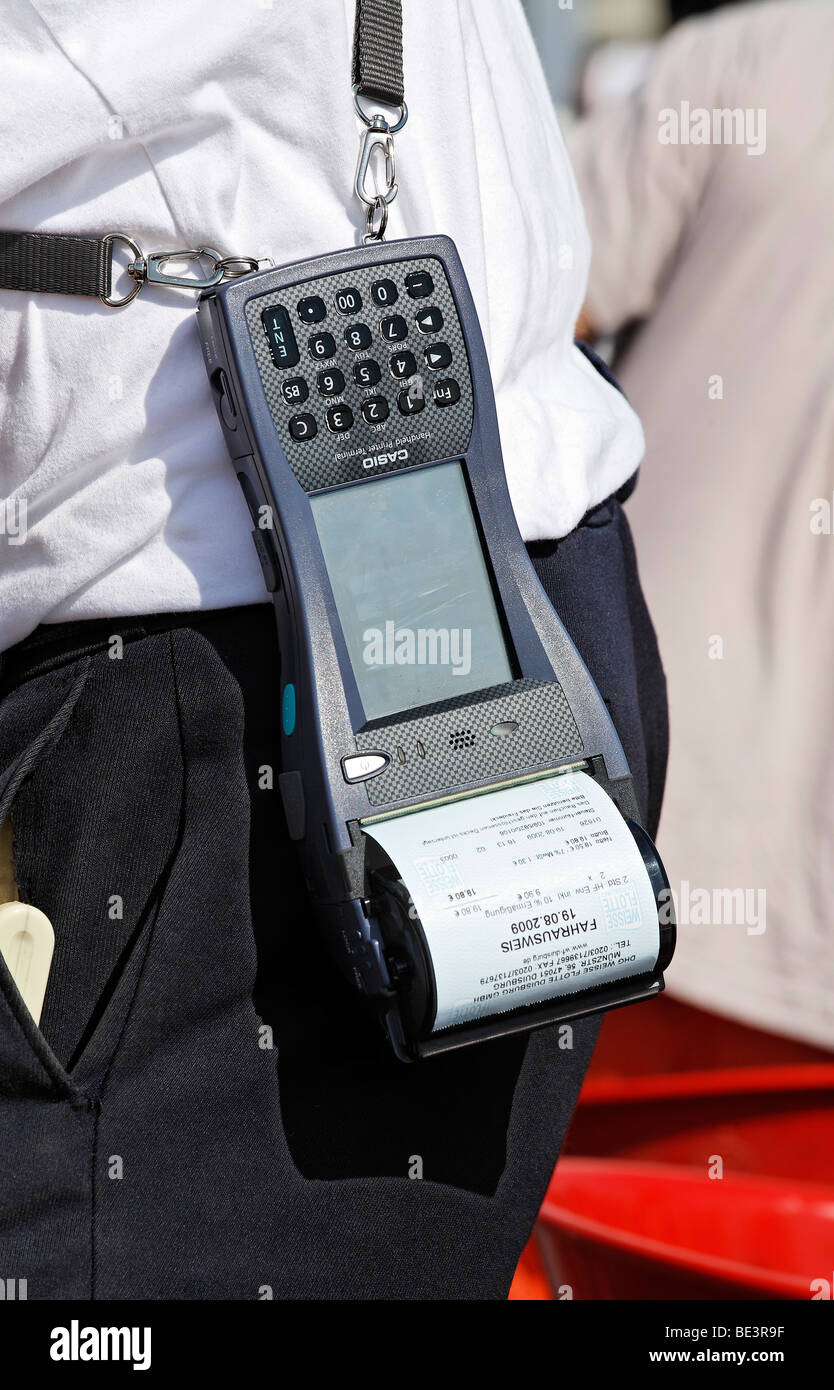 Porter with Casio Handheld Printer Terminal, finished ticket in the printer, harbor cruise, Duisburg-Ruhrort, North Rhine-Westp Stock Photo