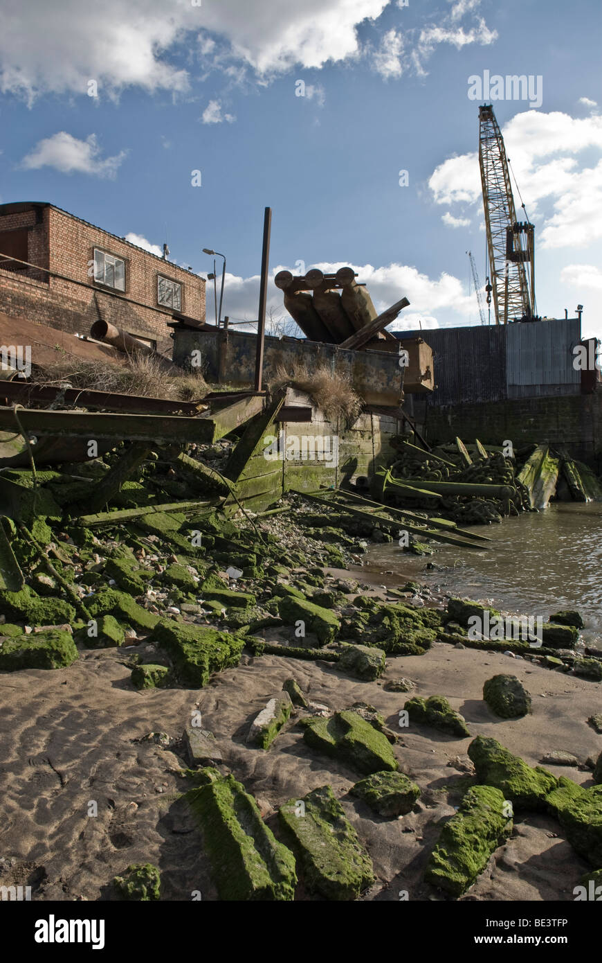 Working ship yard with scrap metal by the banks of the Thames, London, UK Stock Photo