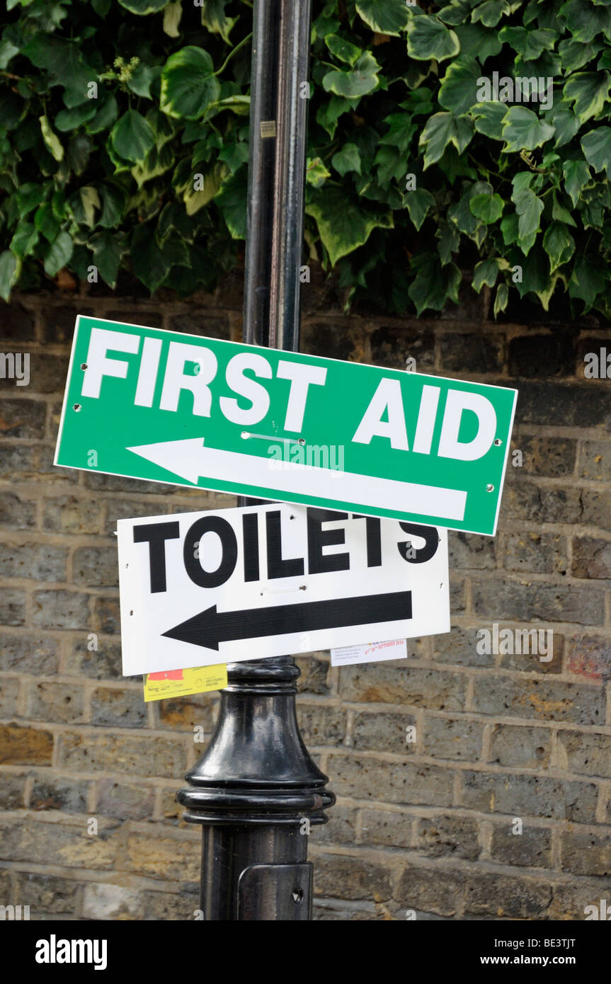 First Aid and Toilets direction signs Stock Photo
