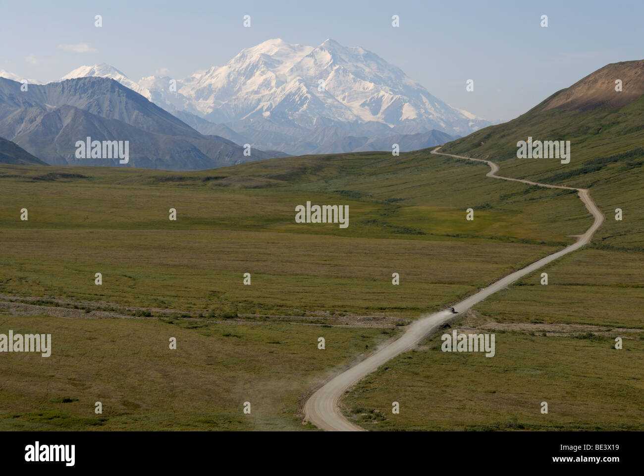 Backcountry road, Denali, Alaska with one car leaving a dust trail Stock Photo