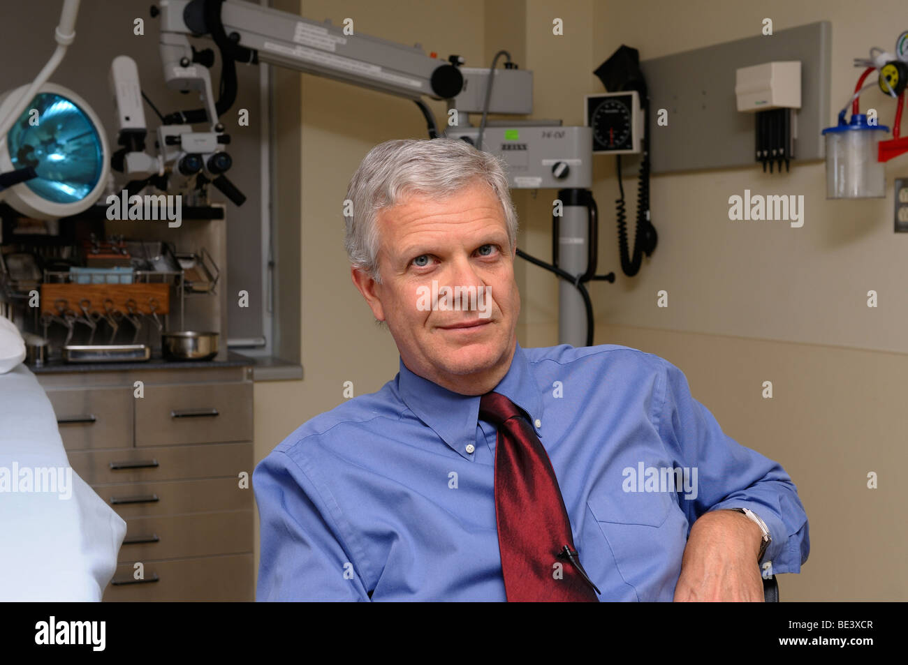 Ear nose and throat doctor or otolaryngologist in the clinic examining