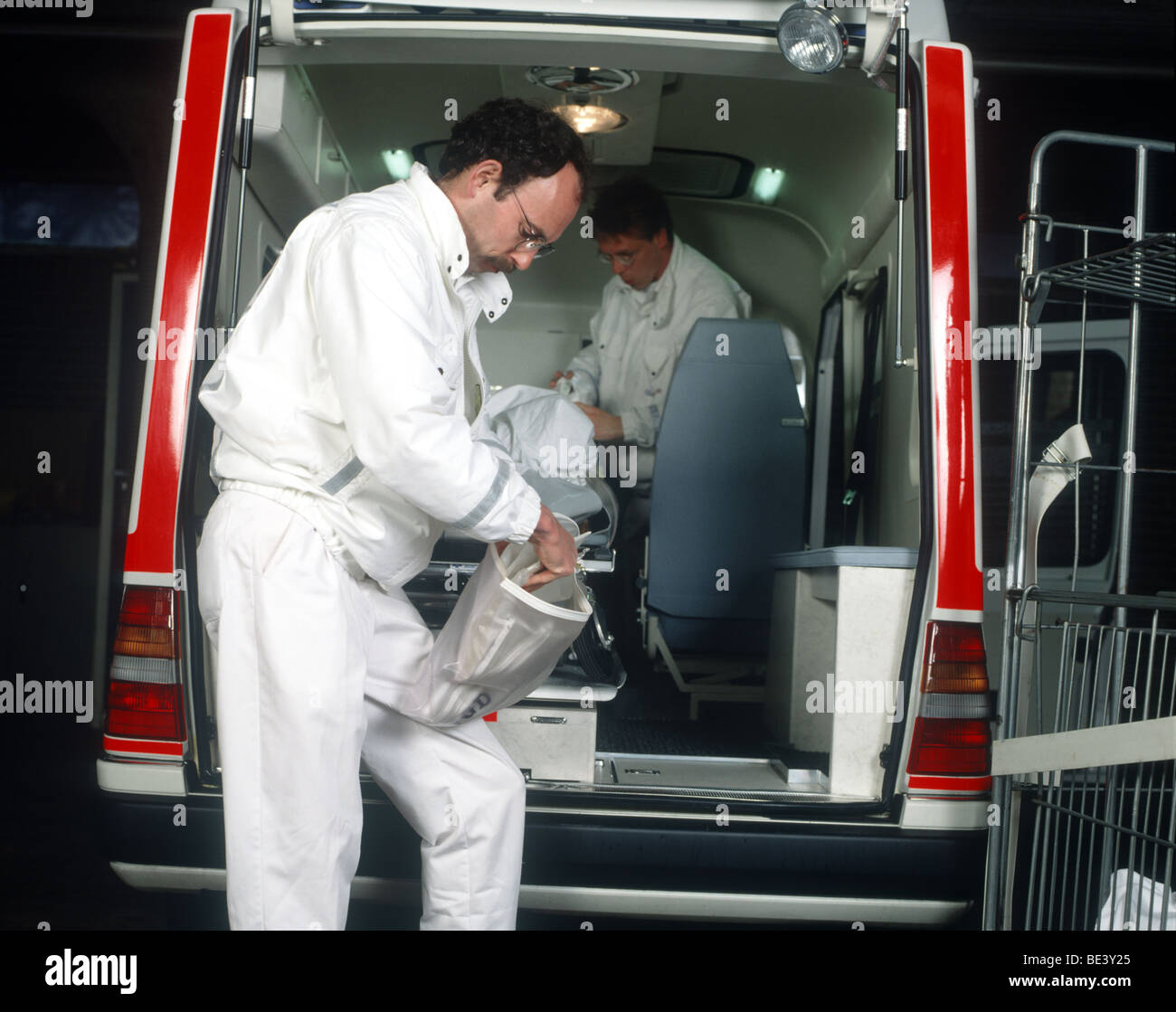 Ambulance medics cleaning the ambulance SerieCVS100023163 Stock Photo