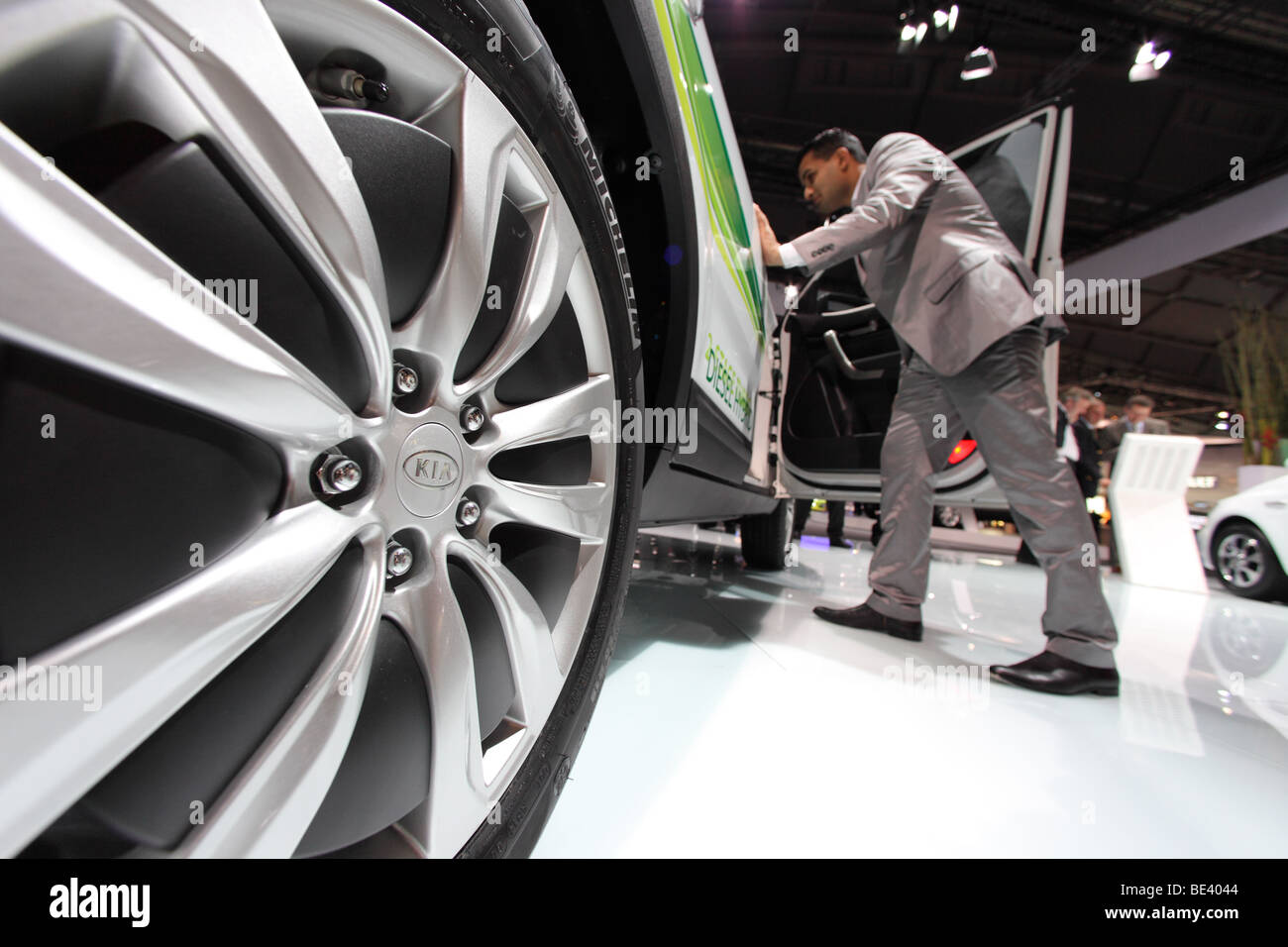 63th International Motor Show ( IAA ): A visitor is interested in a car of the manufacturer Kia Stock Photo