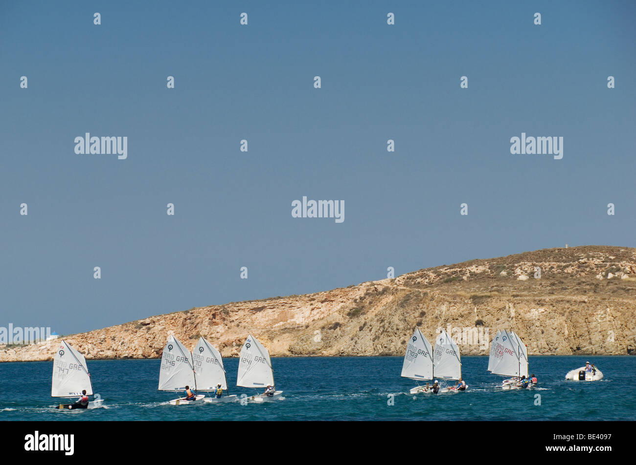 Optimist class sailing dinghies racing In Greece Stock Photo Alamy