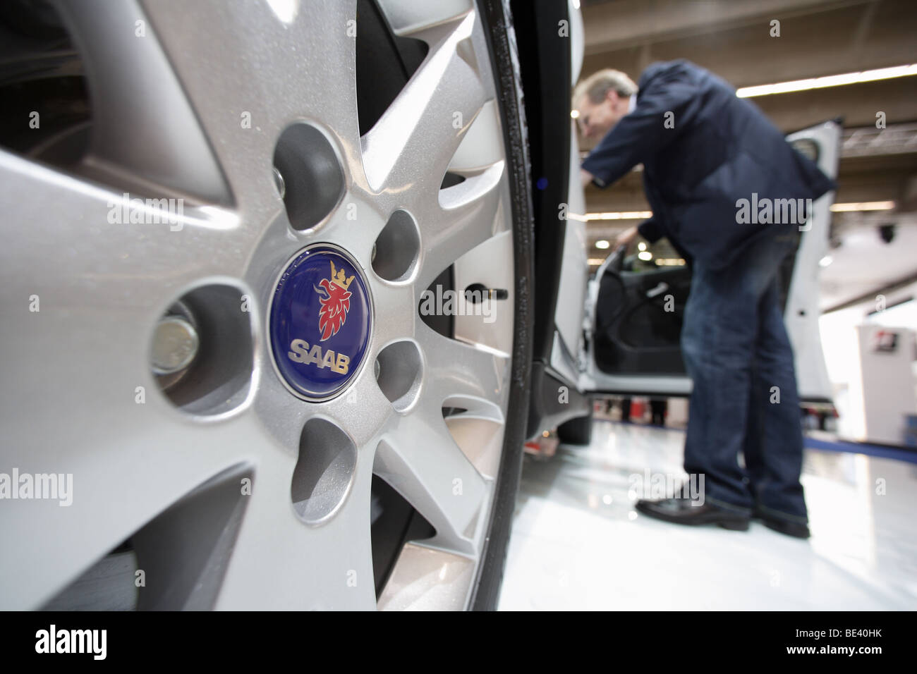 63th International Motor Show ( IAA ): A visitor is interested in a car of the manufacturer Saab Stock Photo