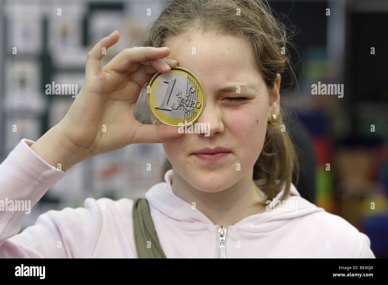 Ein Maedchen mit einem Euro Stock Photo