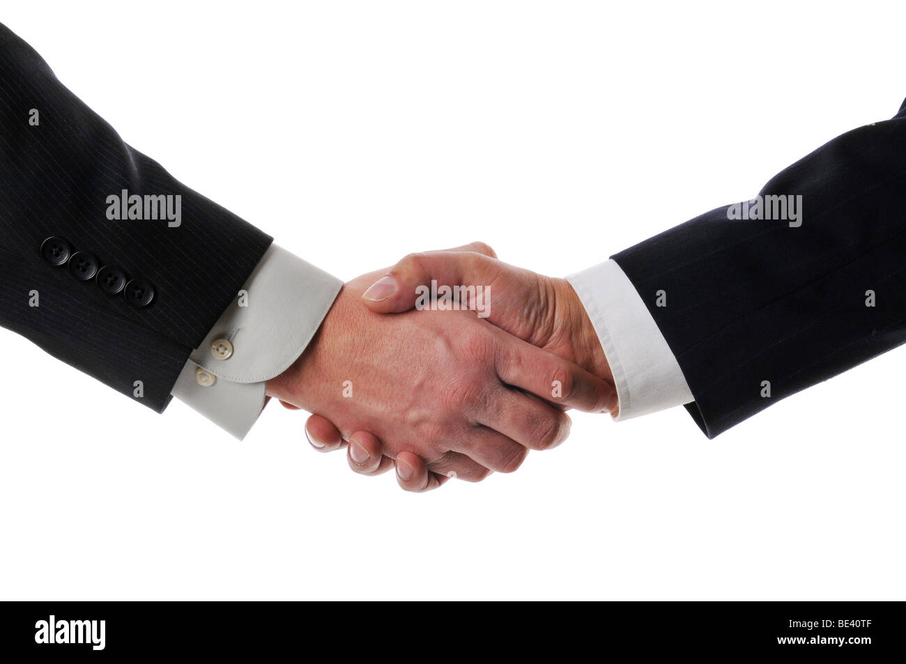 Handshake between businessmen isolated against a white background Stock Photo