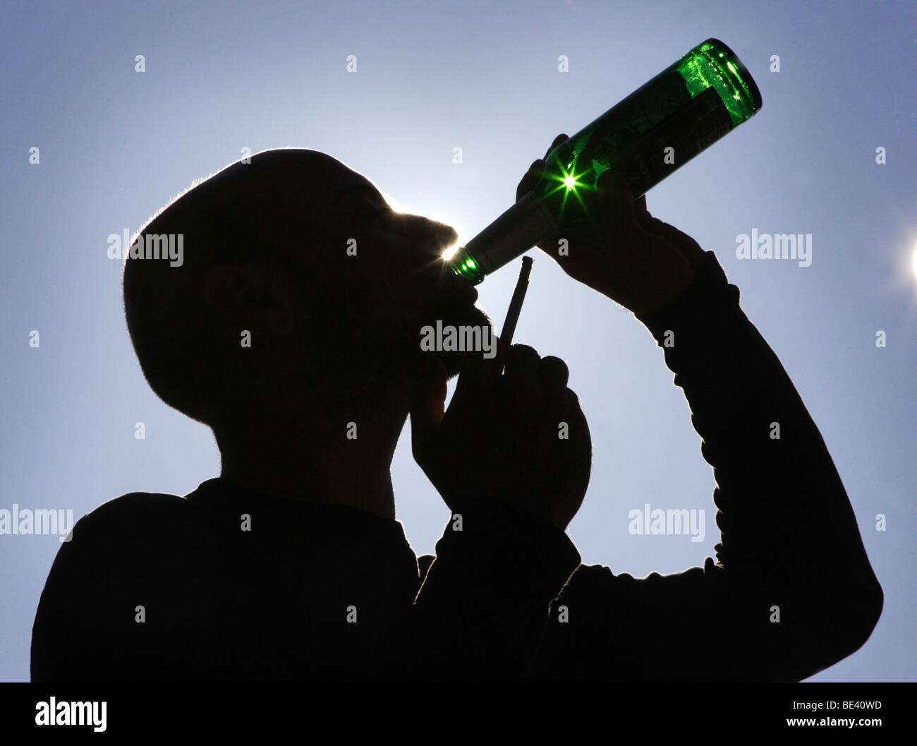 YOUNG MAN DRINKING BEER. Stock Photo