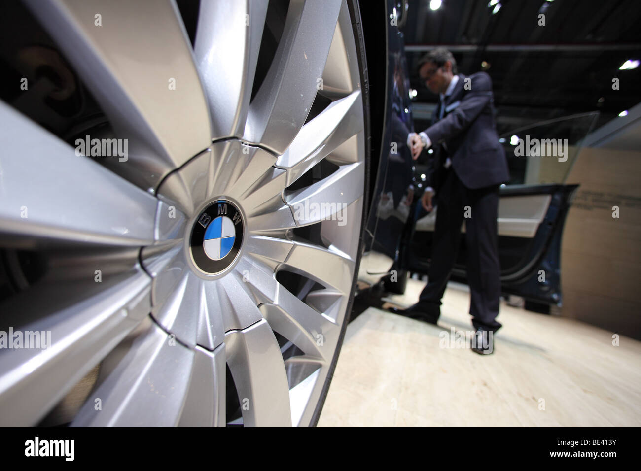 63th International Motor Show ( IAA ): A visitor is interested in a car of the manufacturer BMW Stock Photo