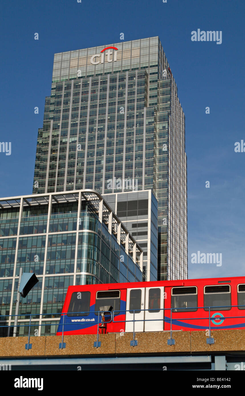 A Docklands Light Railway train passing in front of 25 Canada Square, Citibank Headquarters, London Docklands, UK. Stock Photo