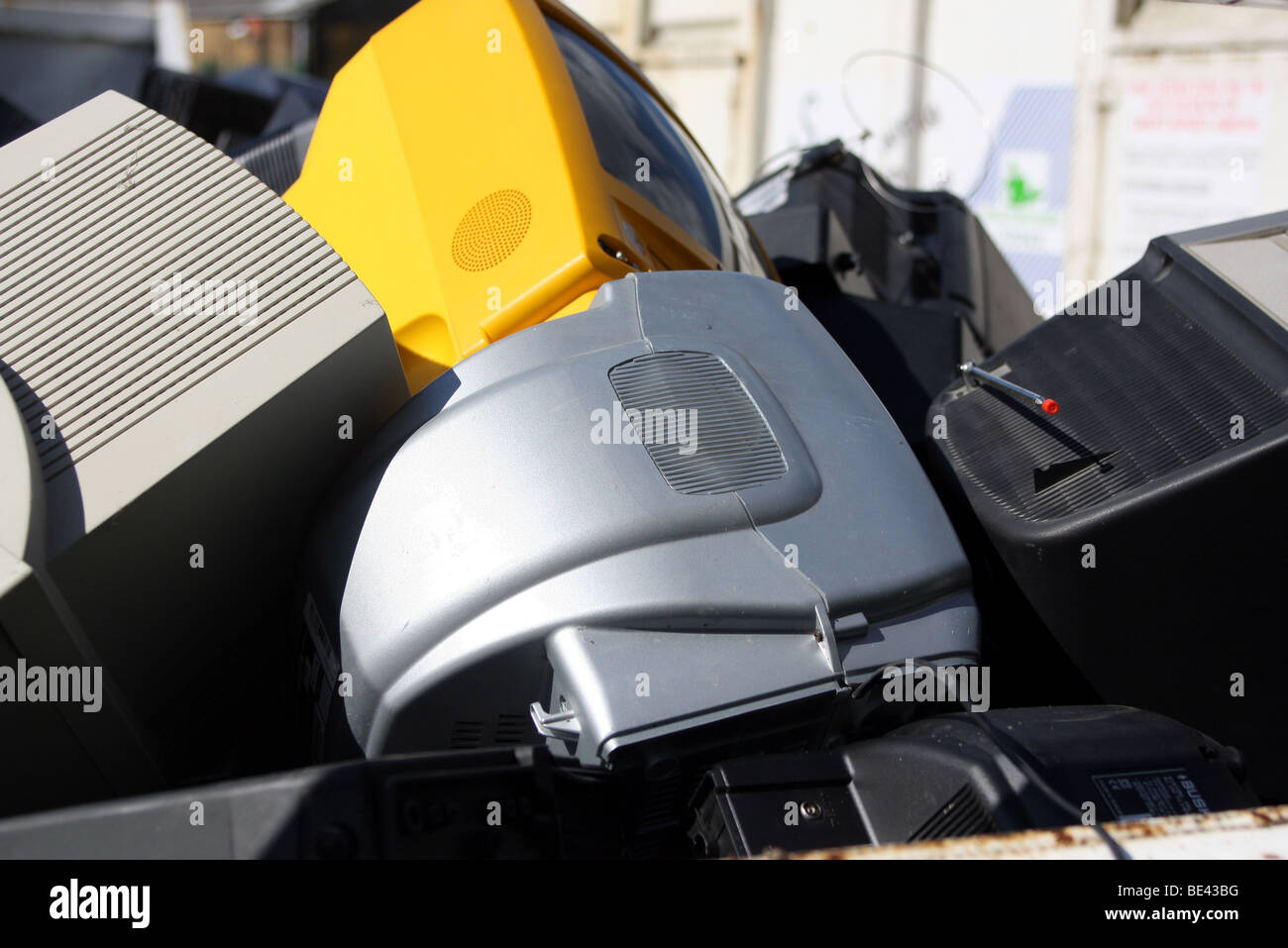 televisions in  recycling skip in a council tip Stock Photo