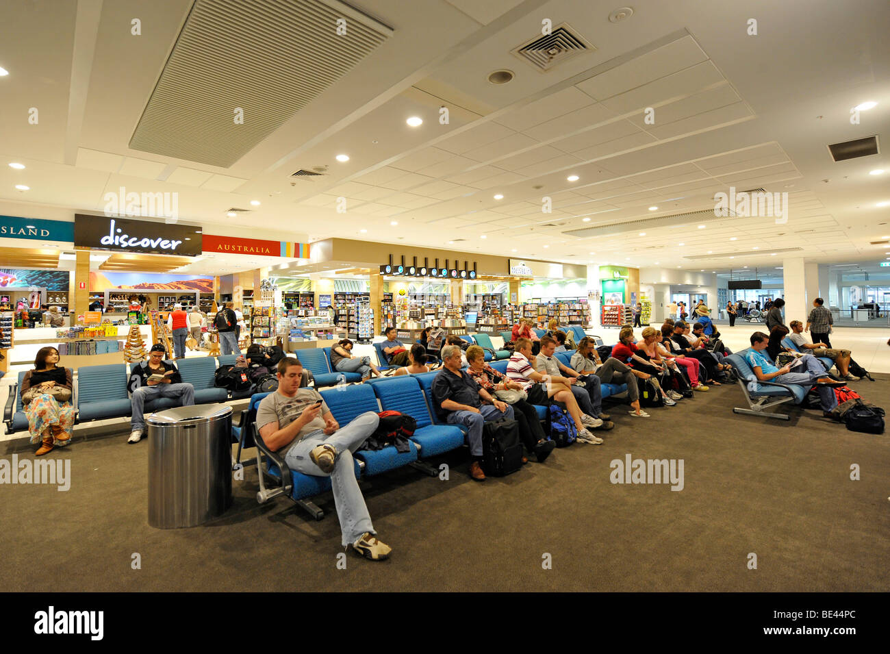 Stores and passengers at an airport gate, waiting area, Brisbane International Airport, Brisbane, Queensland, Australia Stock Photo