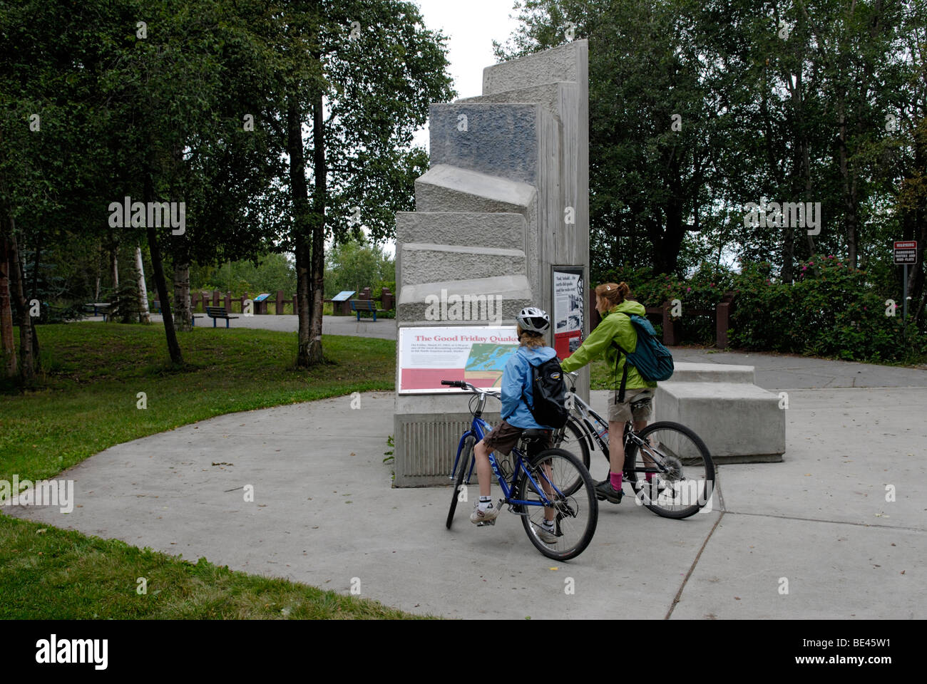 Mother and daughter reading memorial at Earthquake Park, along the Coastal Trail Anchorage, Alaska. Stock Photo