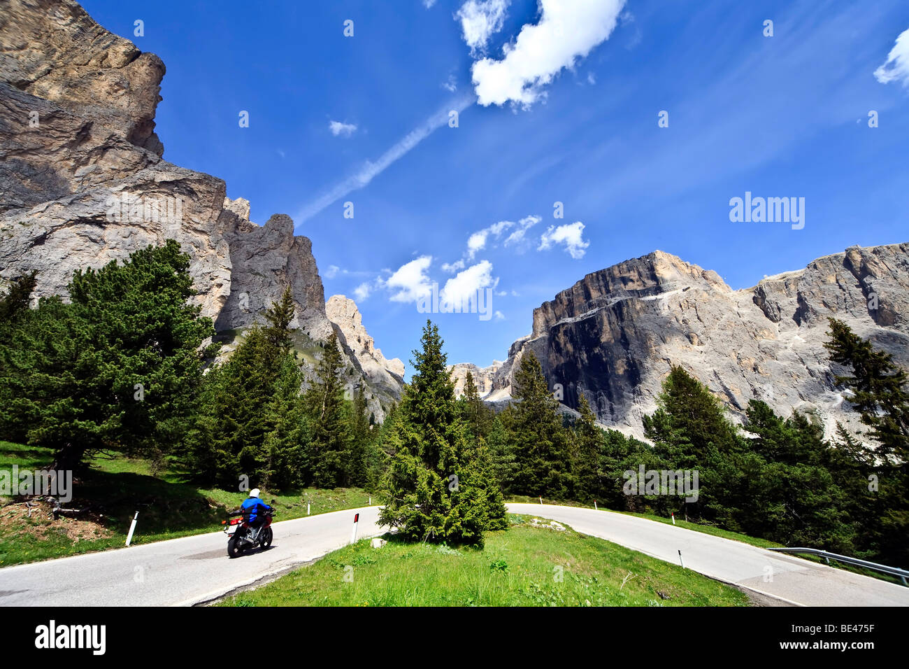 Motorcyclist in front of the the Sella massif in the Dolomites, Italy, Europe Stock Photo