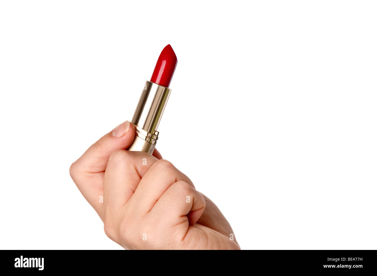A horizontal image of a womans hand holding red lipstick Stock Photo