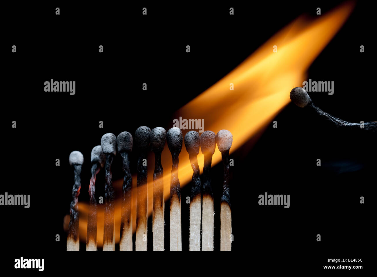 A group of burning matches on black Stock Photo