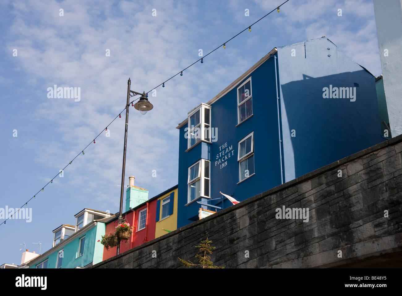 Row of colourful houses over looking train station, Devon. Stock Photo