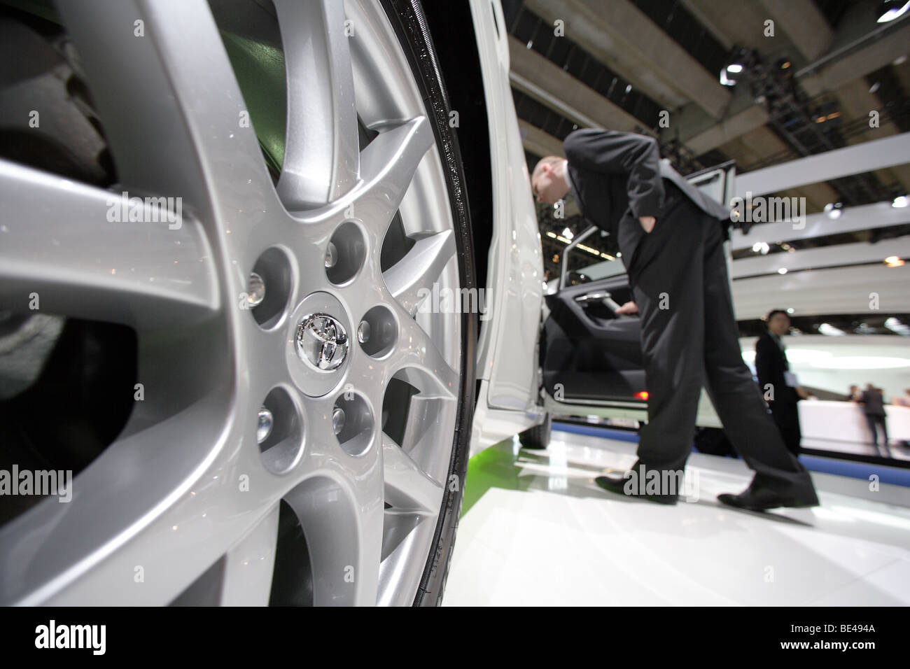 63th International Motor Show ( IAA ): A visitor is interested in a car of the manufacturer Toyota Stock Photo