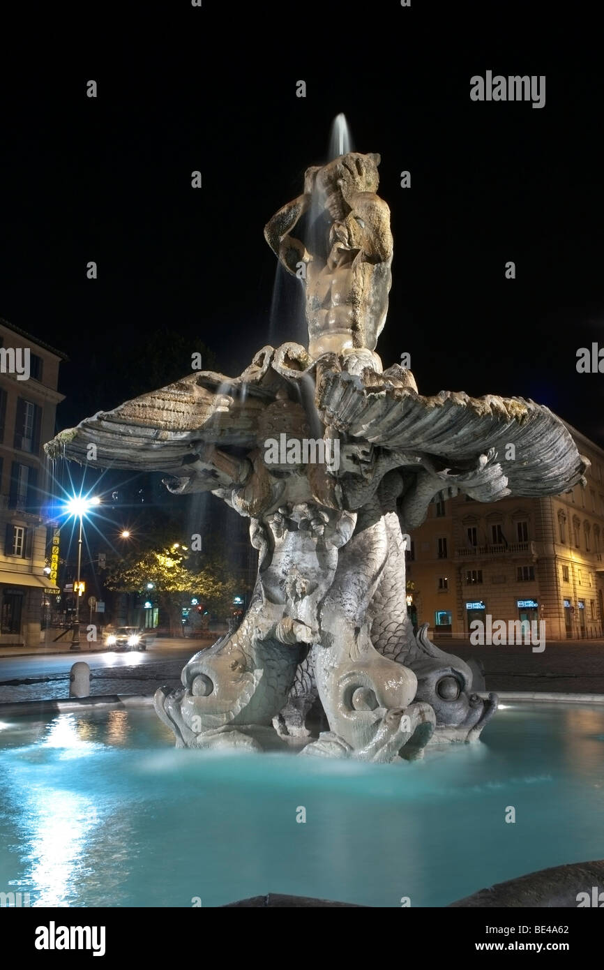 Fontana del Tritone by Gian Lorenzo Bernini in Piazza Barberini in Rome, by night. Stock Photo