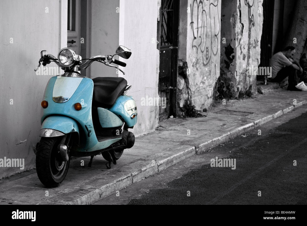 A light-blue scooter/vespa parked in an alley in Plaka, Athens, Greece Stock Photo