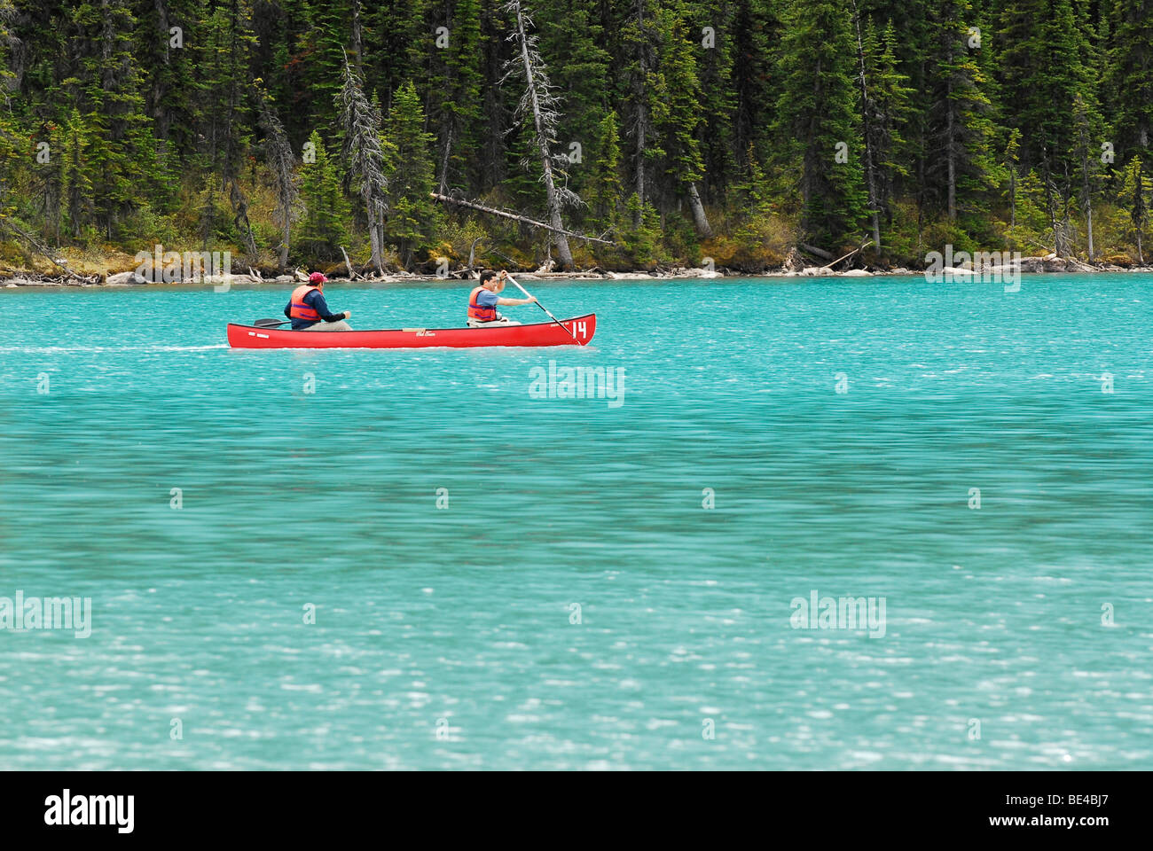 Canoeing on Lake Louise in Banff National Park, Alberta, Canada Stock Photo