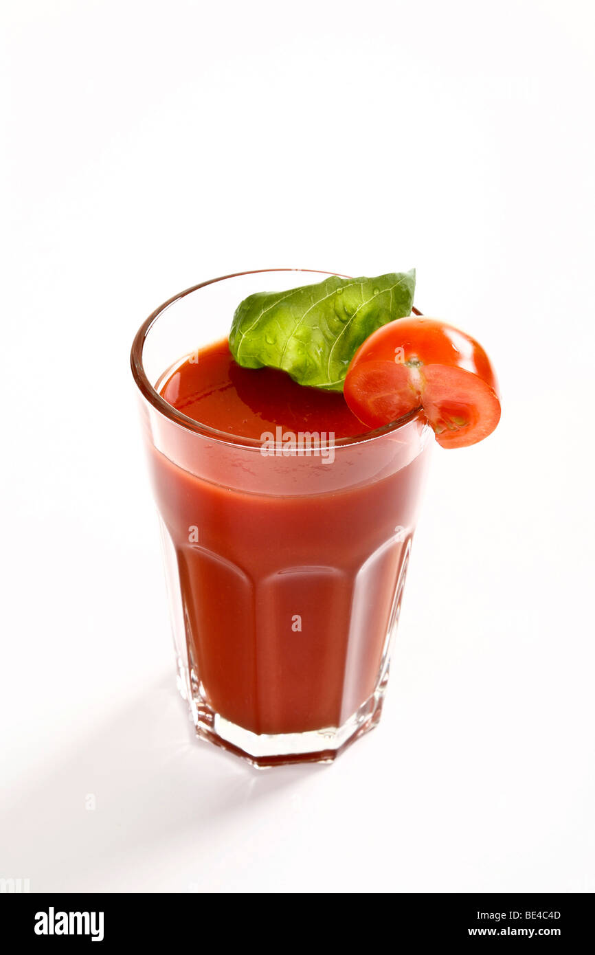 Glass of tomato juice with basil Stock Photo Alamy