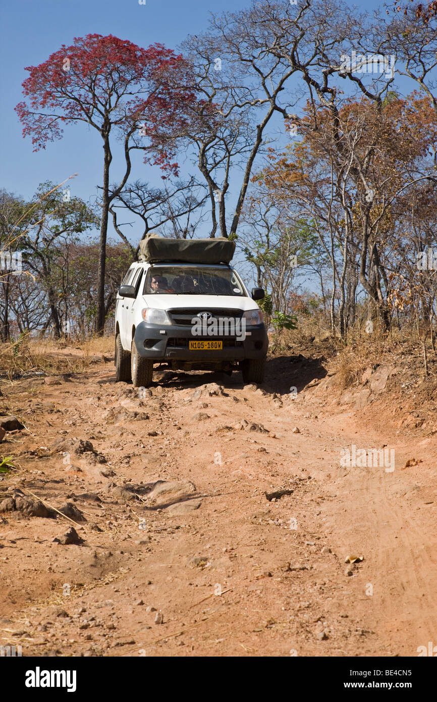Four-wheel drive vehicle driving on an off-road track in Zambia, Africa Stock Photo