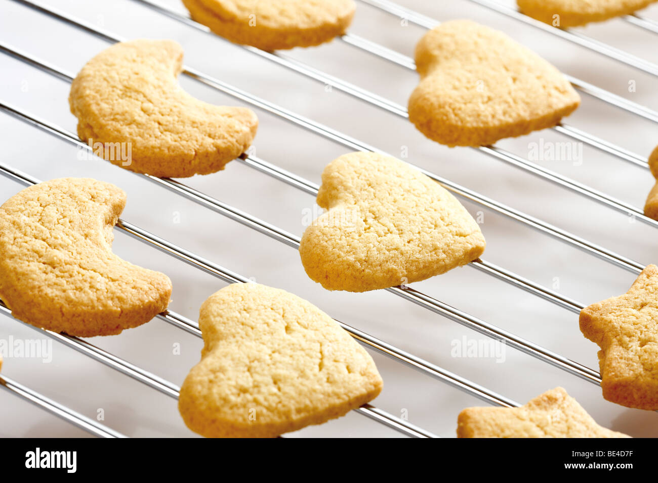 Shortcrust cookies on oven grid Stock Photo