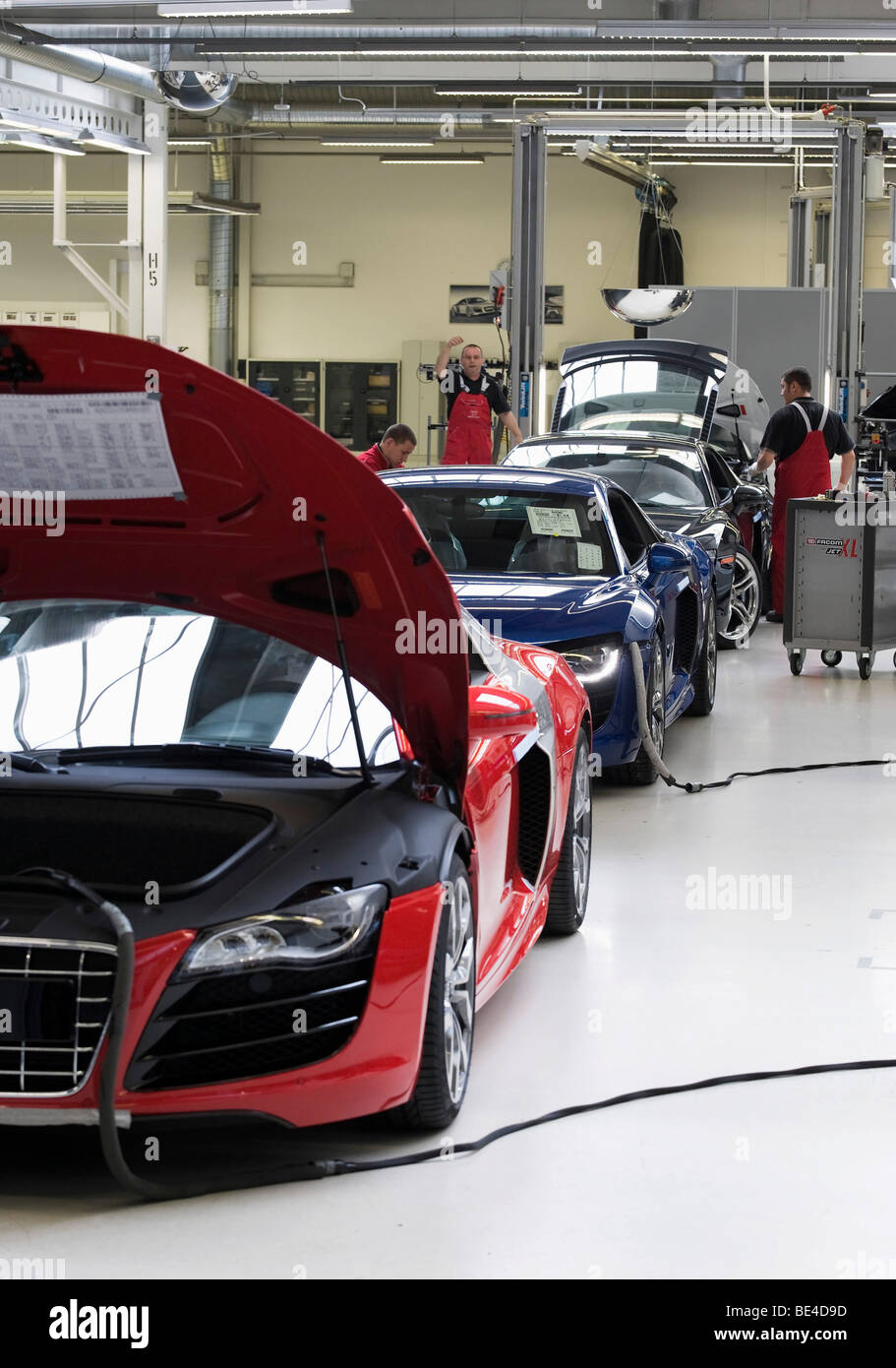 Audi employees doing final inspections of the Audi R8 sports car at the