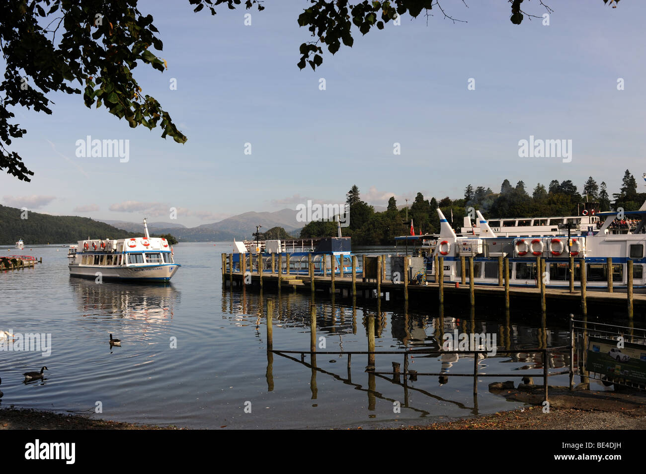 Cruise boats on Lake Windemere at Bowness in The Lake District in Cumbria UK Stock Photo