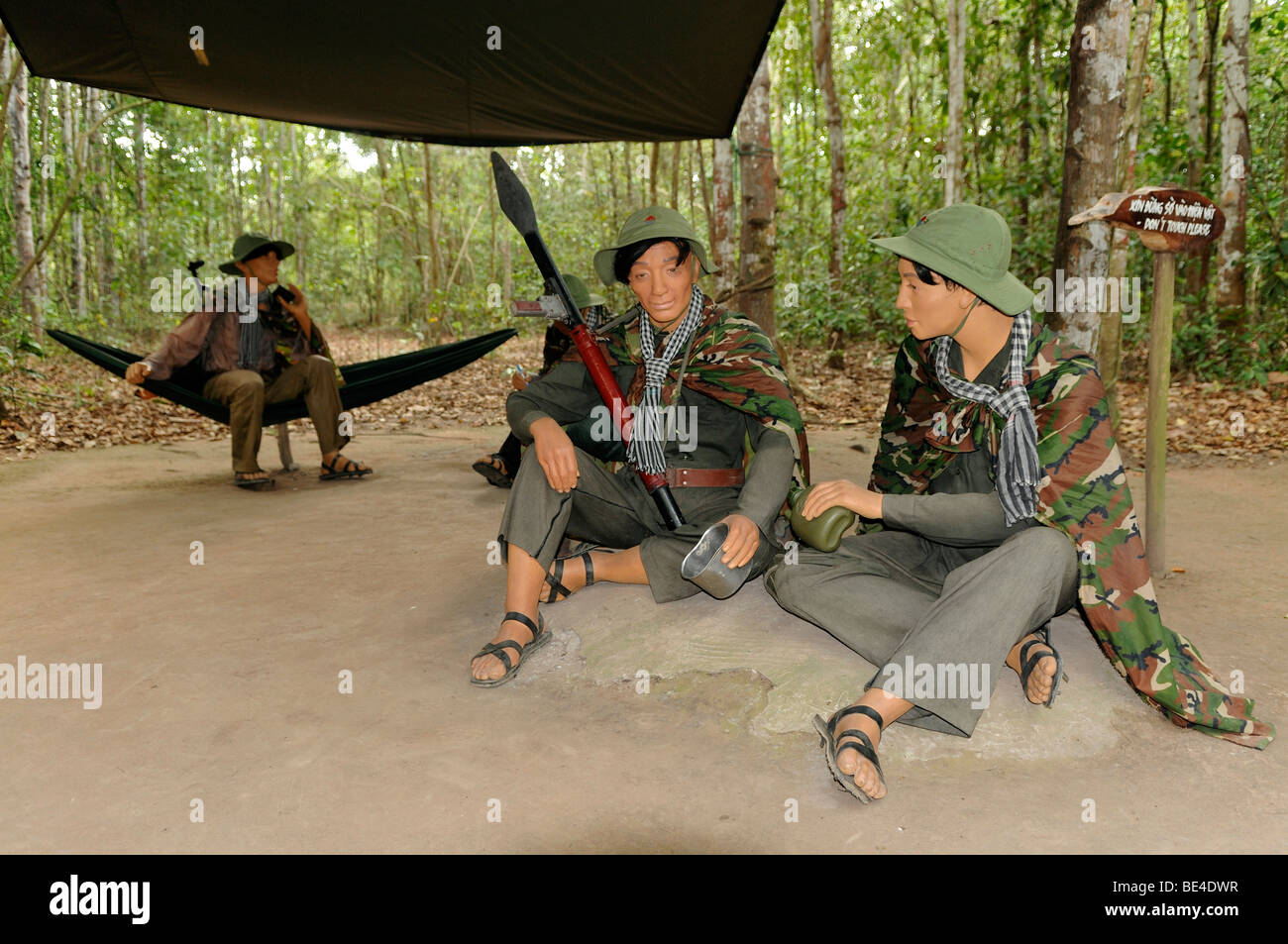 Dolls, armed Vietnamese soldiers sitting in a jungle camp, Cu Chi caves, Vietnam, Southeast Asia Stock Photo