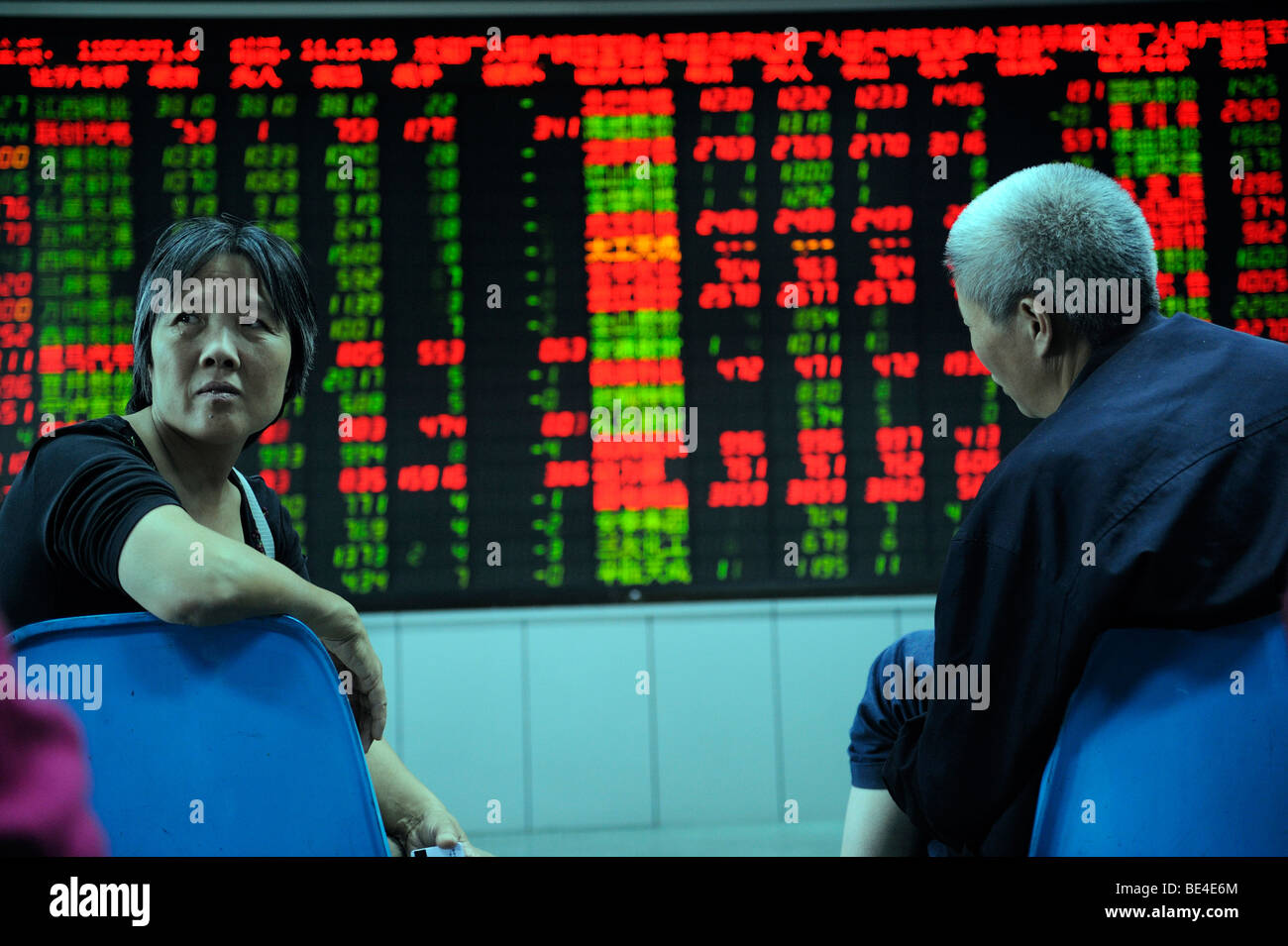 Investor look at stock index quotes at a securities firm in Beijing, China. 21-Sep-2009 Stock Photo