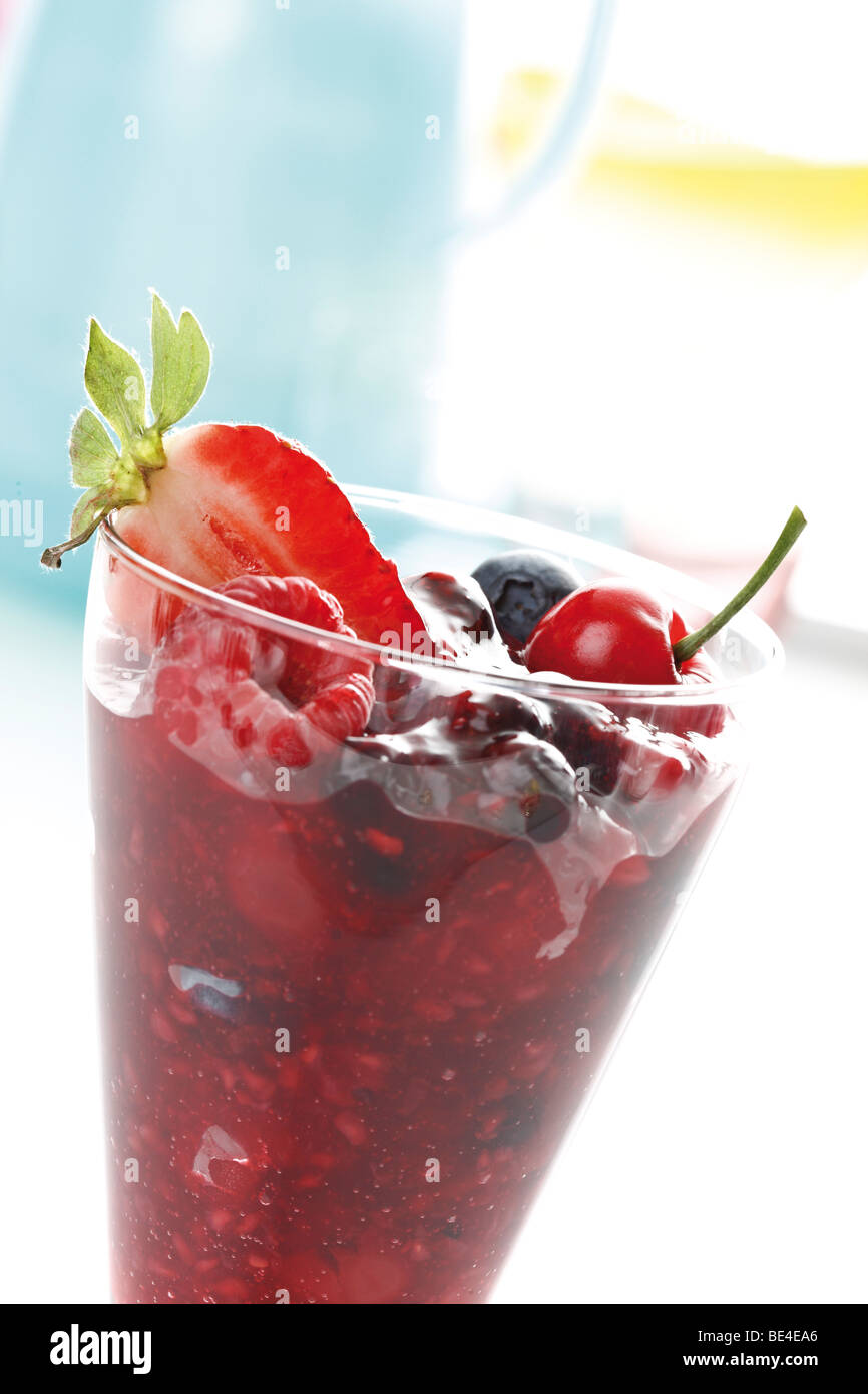 Berries in a glass, red berry compote, raspberries, blueberries, strawberries Stock Photo