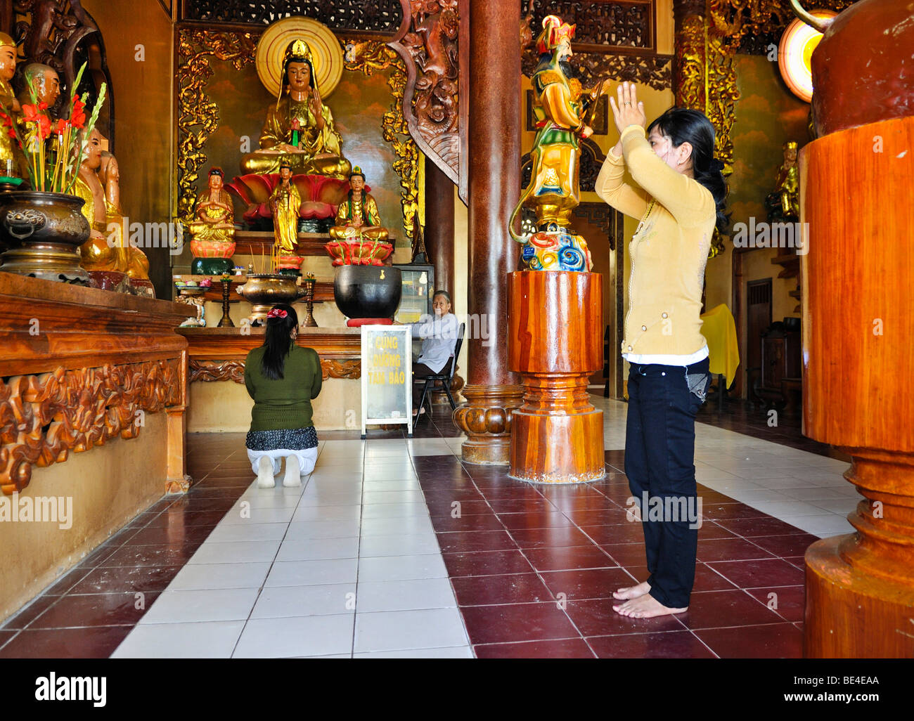 People praying in a Buddhist temple on the mountain of the black woman, Nui Ba Den, Tay Ninh, Vietnam, Asia Stock Photo
