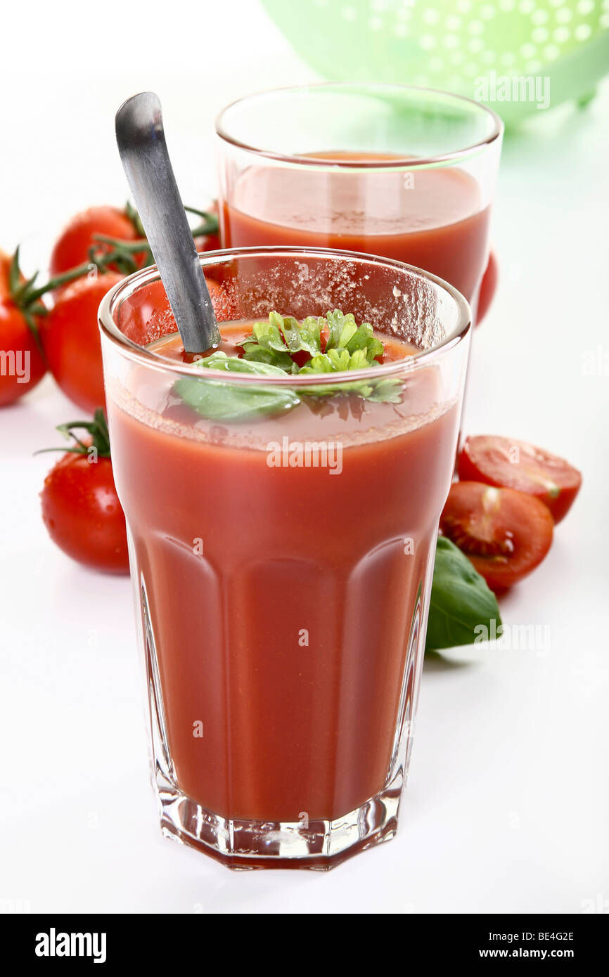 Tomato juice with basil and parsley Stock Photo