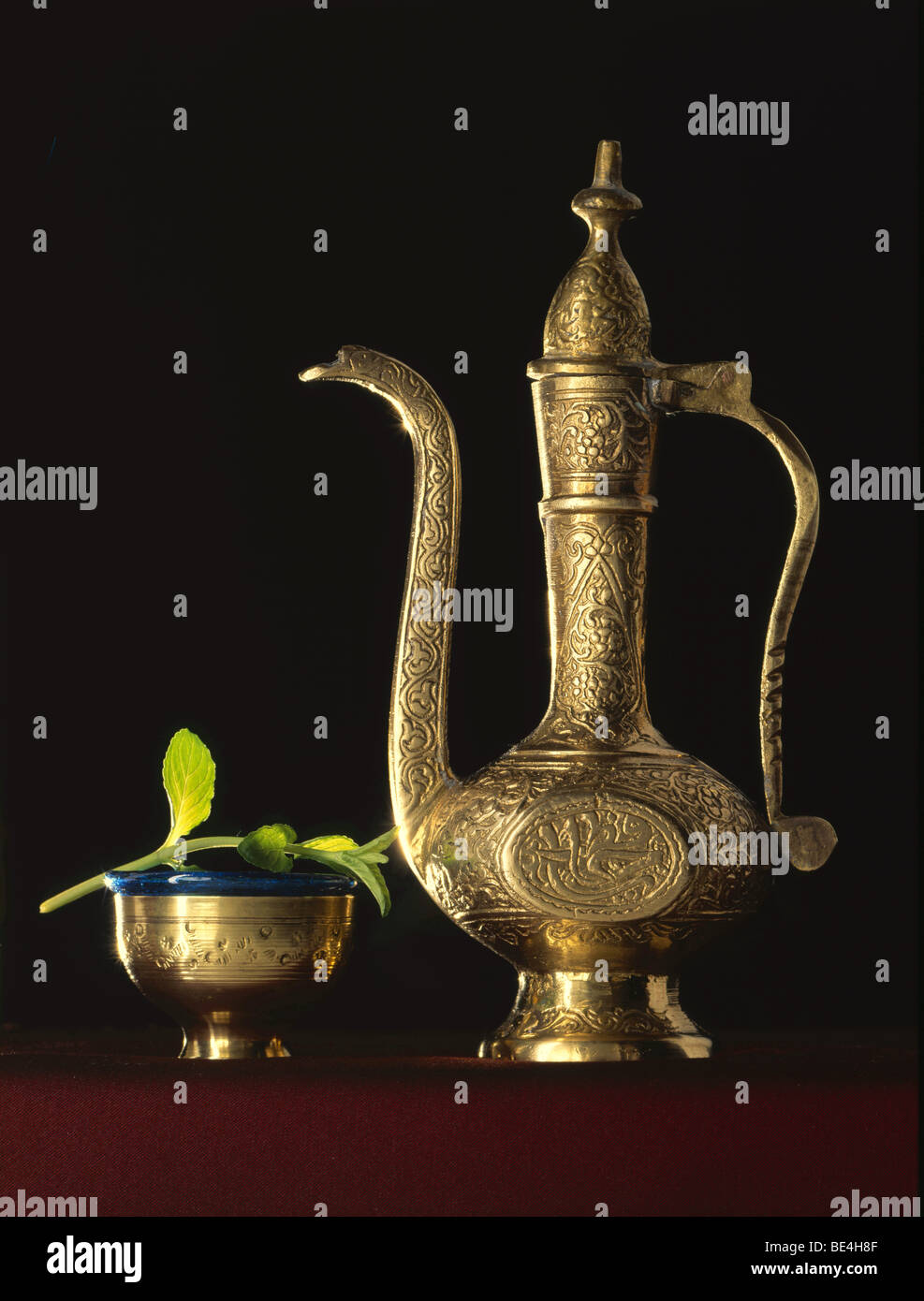 Teapot with fresh tea leaves Stock Photo Alamy